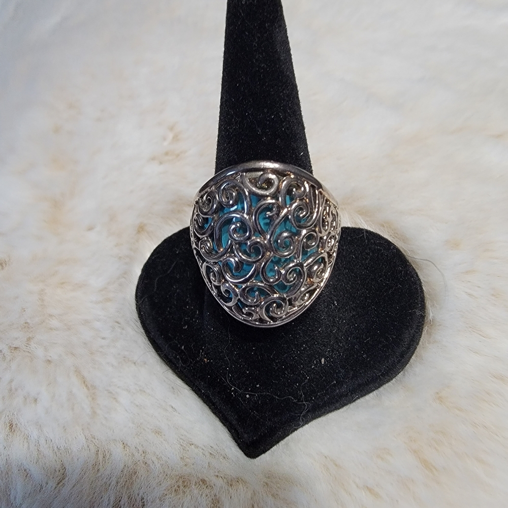 Scroll ring with turquoise backdrop.  Size 6.  Set in SS.
